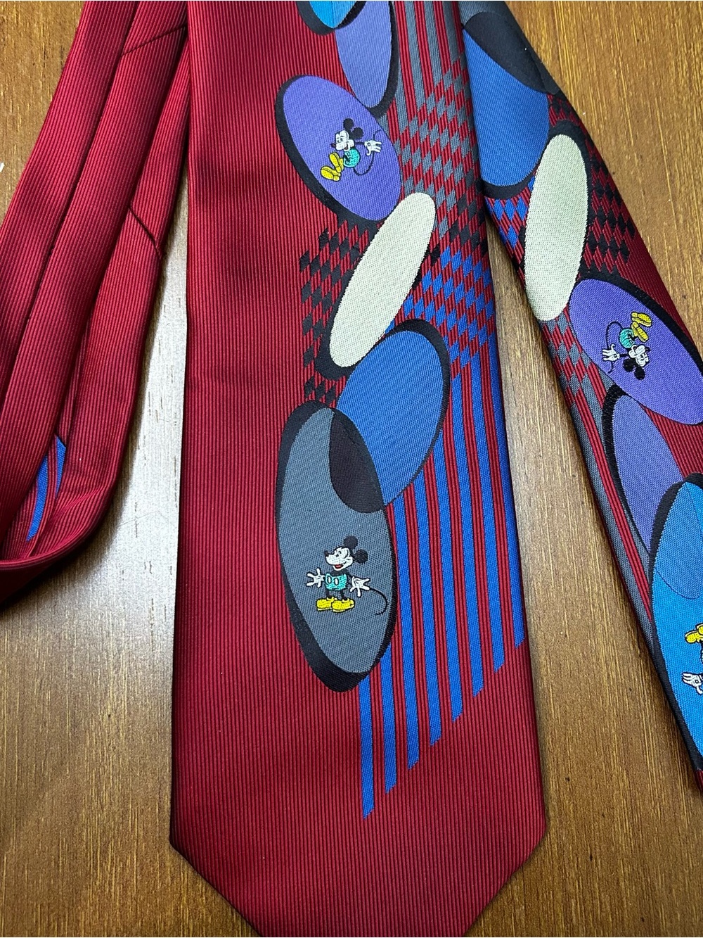 Disney Mickey Mouse Burgundy Tie with Blue and Purple Motifs. 58.5 inches